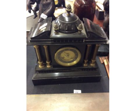 A late Victorian black slate two hole mantel clock of architectural form