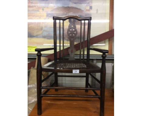 A child's cane seated stick and wheelback elbow chair 