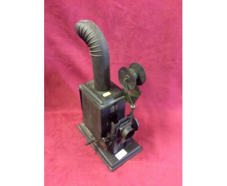 An early hand operated moving film projector