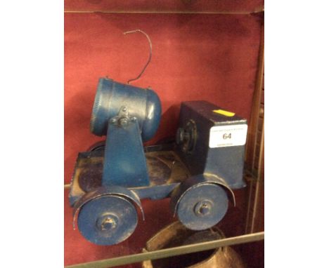 A WW2 metal scratch built working model of a search light unit, possibly made by a Prisoner of War