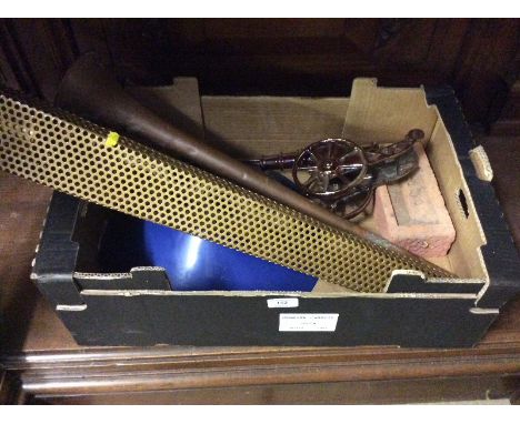 A box containing a Royal Wedding brick; a model canon; a hunting horn etc. 