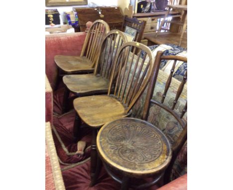 Three elm seated stick back chairs together with bentwood chair