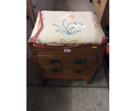 A upholstered stool fitted two drawers with Art Nouveau handles