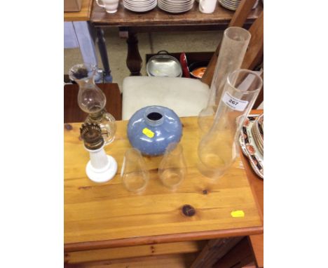 A quantity of various oil lamp parts