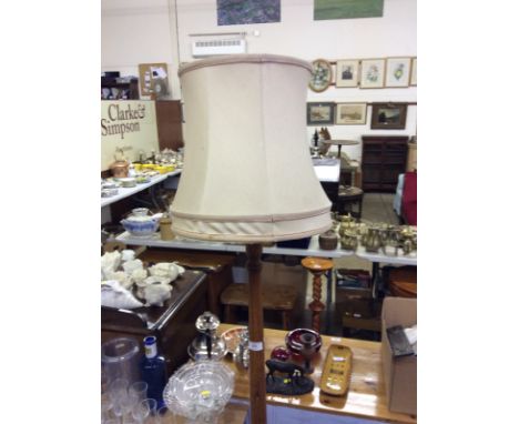 An oak standard lamp and shade