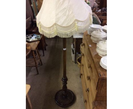 An oak standard lamp and shade