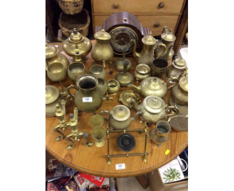 A large quantity of various brassware to include tea and coffee pot; a pair of fire dogs; goblets etc. together with an oak c