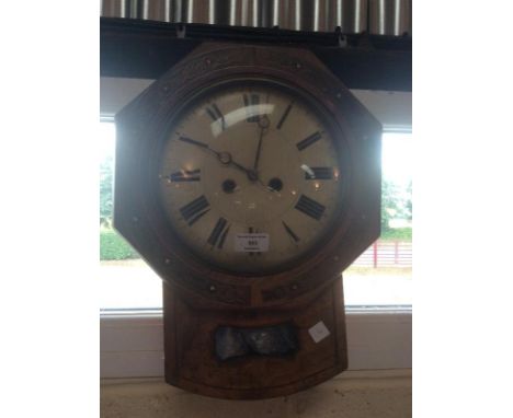 A brass inlaid wall clock