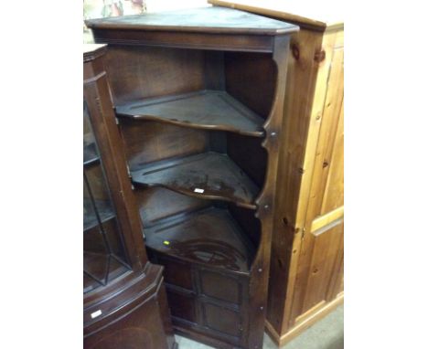 A dark Ercol corner unit`