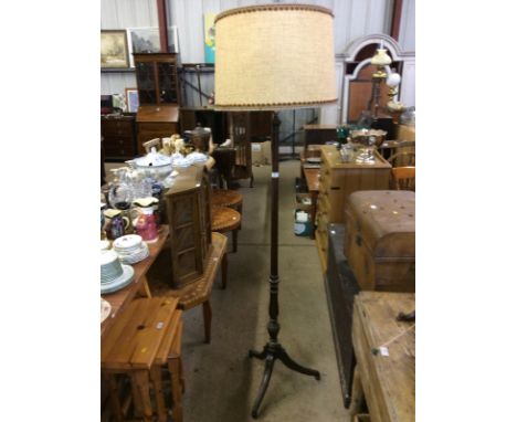 A mahogany standard lamp and shade 
