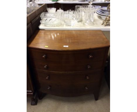 A 19th Century mahogany bow front commode, raised on bracket supports