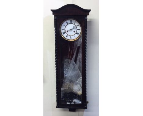 A large regulator wall clock with barley twist supports to white enamelled dial. Est. £80 - £120.