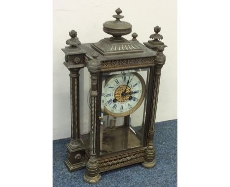 A good quality French mantle clock with glass sides and turned supports. Est. £100 - £150.