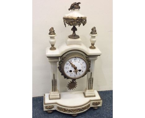 An attractive late Victorian marble mantle clock with brass decoration. Est. £80 - £120.