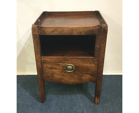 A Georgian mahogany commode on square reeded supports. Est. £20 - £30.