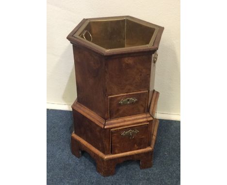 An unusual hexagonal 18th Century walnut wine cooler on bracket feet. Approx. 49 cms high. Est. £250 - £300. 