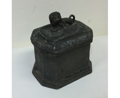 A good Antique lead tea caddy with lion finial. Est. £50 - £80.