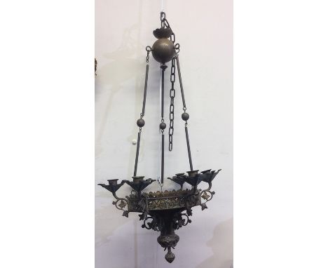 A good Gothic style brass and copper light pendant with scroll decoration. Est. £30 - £50.