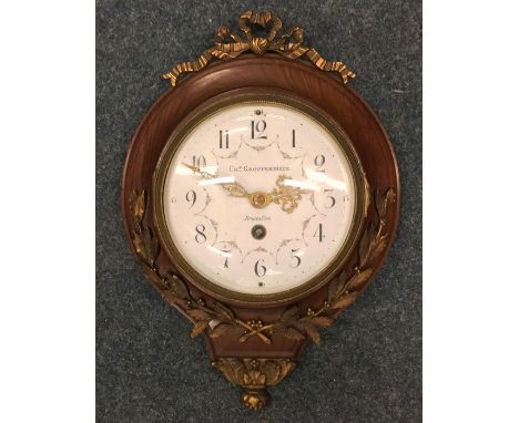 A brass mounted Dutch wall clock with white enamelled dial. Est. £50 - £80.