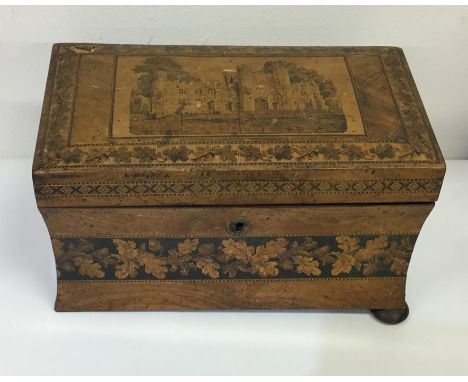 An unusual Tunbridge ware tea caddy with curved body to bun feet. Est. £100 - £150.