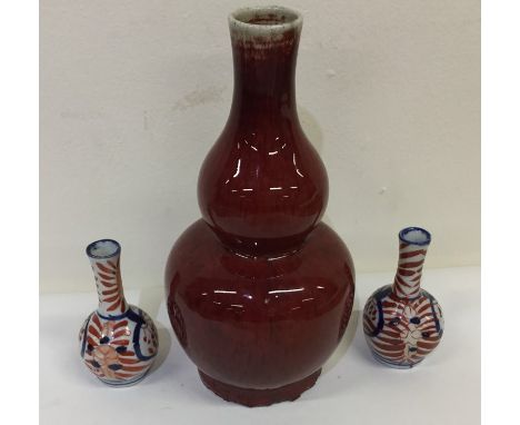 A good Chinese baluster shaped vase, with seal mark to base, together with two smaller Chinese vases. Est. £30 - £50.