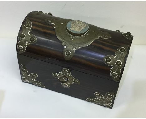 A good quality domed tea caddy with Wedgwood panel and brass mounts. Est. £40 - £60.