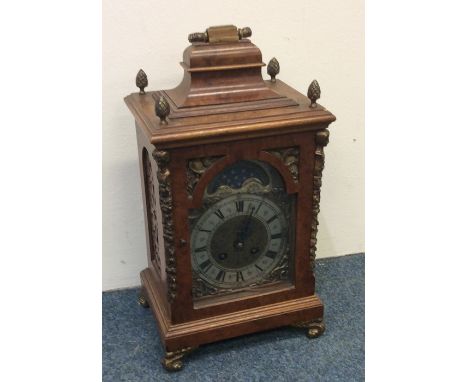 A good quality burr walnut bracket clock with striking movement and silvered dial. Est. £120 - £150.