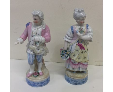 A pair of decorative figures together with a Shelley vase. Est. £15 - £20.