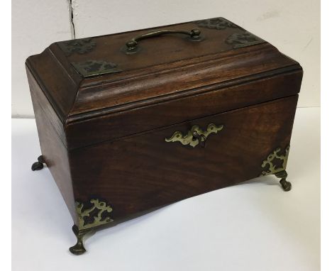 A Georgian mahogany rectangular top tea caddy with brass mounts. Est. £30 - £50.