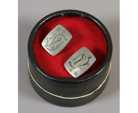 A pair of Jorgen Jensen pewter cufflinks engraved with cave drawings.