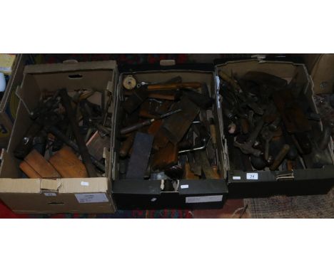 Three boxes containing a quantity of vintage tools to include plains, set squares, drill bits, hand drills, hammers etc.