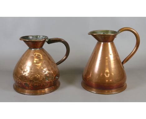 Two vintage copper water jugs one marked Imperial and both marked Gallon.