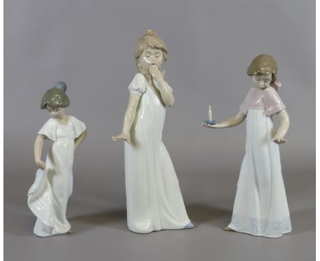 Three Nao figures dancing girl, suprised girl etc.