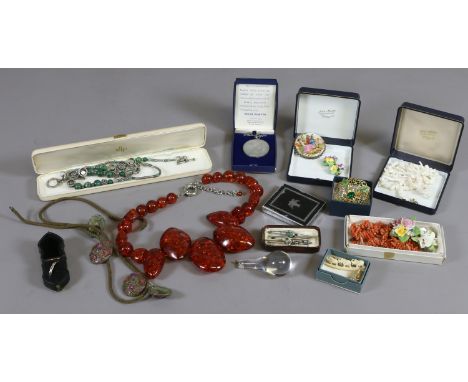 A box of vintage costume jewellery including coral and an amber effect necklace.