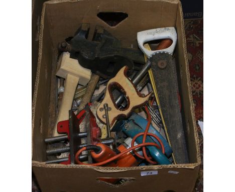 A box of hand tools, a record vice and another vice.