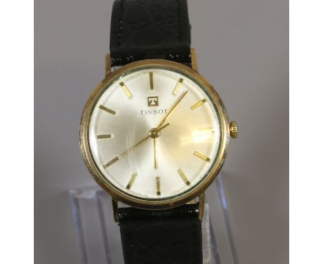 A gentleman's 9ct gold cased Tissot manual wristwatch with satin dial, baton markers and centre seconds. Condition Report. To