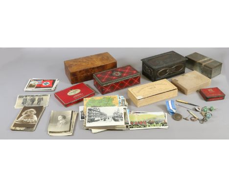 A box of tins, boxes and postcards to include walnut, tartan and vintage street scenes.