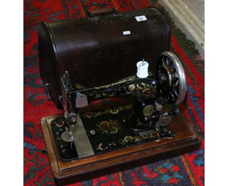 A cased manual Singer sewing machine