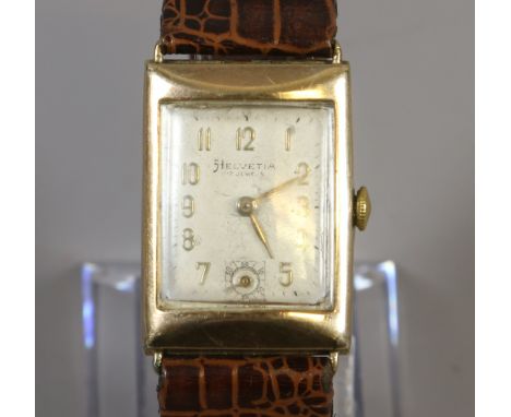 A 9ct gold cased gentleman's vintage Helvetia 17 jewel manual wristwatch with rectangular dial, applied gilt Arabic numeral m
