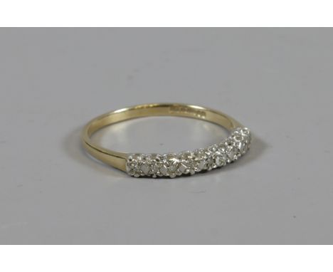 A 9ct gold diamond set half eternity ring, size O 1/2.