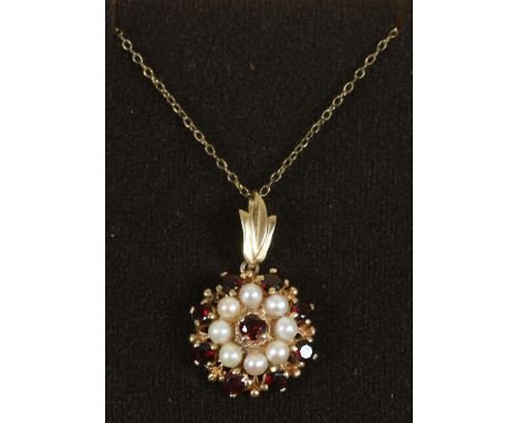 A 9ct gold garnet and pearl cluster pendant on yellow metal chain.