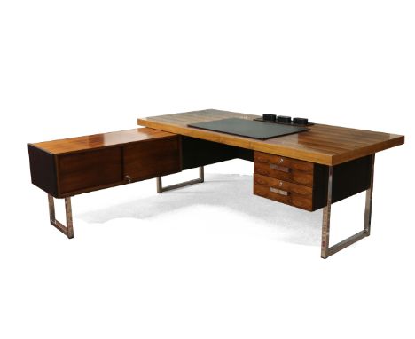 An early 1970s Gordon Russell rosewood Prestige large desk raised on chrome supports, designed by Ray Leigh and Trevor Chinn.
