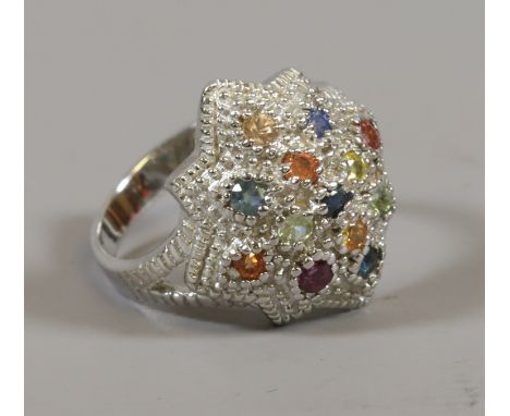 A silver multi gem set cluster ring with starburst shark, size K.