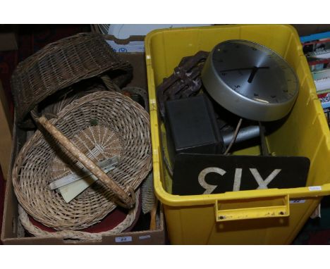 Two boxes containing vintage enamel railway signal markers, gents electric slave clock, cast iron grates, baskets and clothes