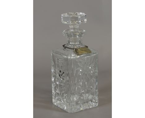 A cut glass decanter with silver plated Whisky label.