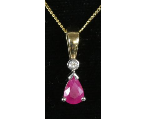 A 9ct gold ruby and diamond pendant on 9ct gold trace necklace.