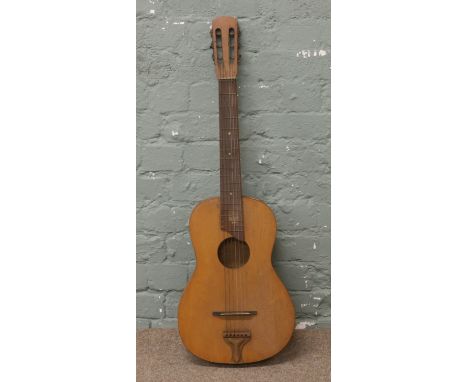A students vintage acoustic guitar.