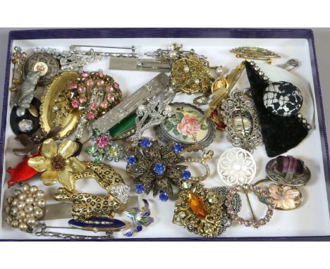 A box of vintage costume jewellery brooches including Art Deco examples.