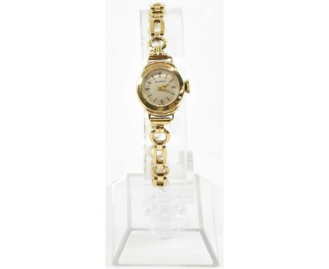 MARC NICOLET; a lady's 9ct gold wristwatch, the silvered dial set with raised baton markers, with crown wind movement, on a 9