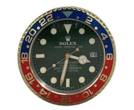 A decorative Rolex Submariner style dealer's wall clock, the green dial set with subsidiary seconds and date aperture and ins